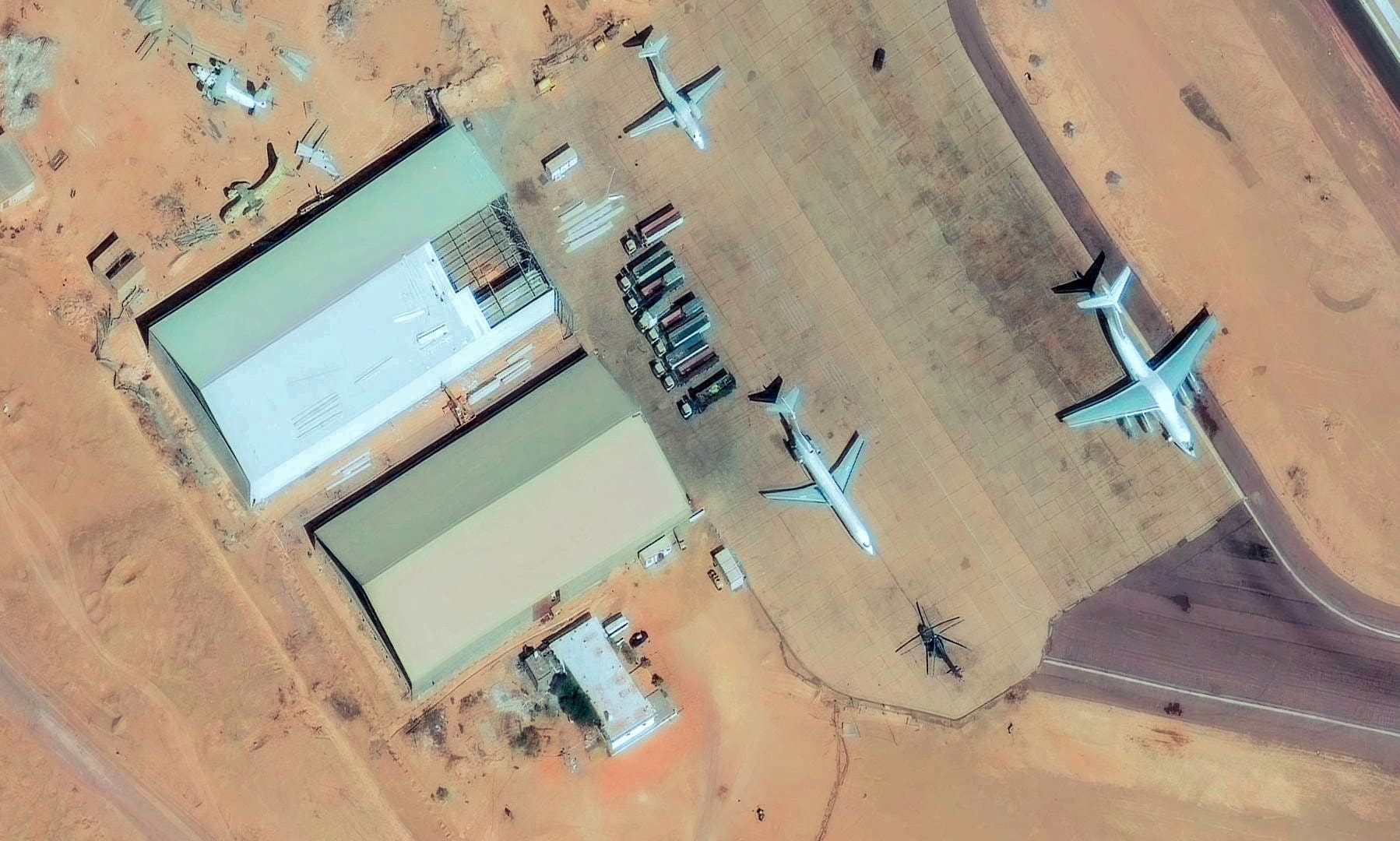 A satellite image shows a Boeing 727 (MSN 22438), which Reuters found to be linked to companies controlled by a U.S. veteran and part of a network identified by United Nations experts as transporting mercenaries, weapons and drones for Sudan's Rapid Support Forces, at the airport in Kufrah, Libya, January 4, 2026. Vantor/Handout via REUTERS. THIS IMAGE HAS BEEN SUPPLIED BY A THIRD PARTY. NO RESALES. NO ARCHIVES. MANDATORY CREDIT. DO NOT OBSCURE LOGO.